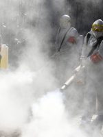 This photo taken on February 18, 2020 shows members of a police sanitation team spraying disinfectant as a preventive measure against the spread of the COVID-19 coronavirus in Bozhou, in China's eastern Anhui province. - The death toll from China's new coronavirus epidemic jumped past 2,000 on February 19 after 136 more people died, with the number of new cases falling for a second straight day, according to the National Health Commission. (Photo by STR / AFP) / China OUT (Photo by STR/AFP via Getty Images)