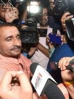 Lucknow: BJP MLA from Unnao Kuldip Singh Sengar, accused in a rape case, surrounded by media persons outside the office of the Senior Superintendent of Police in  Lucknow on Wednesday night. PTI Photo by Nand Kumar(PTI4_12_2018_000001B)