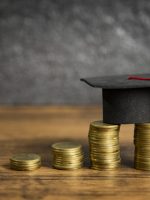 Scholarships education concept with graduation cap on coin money